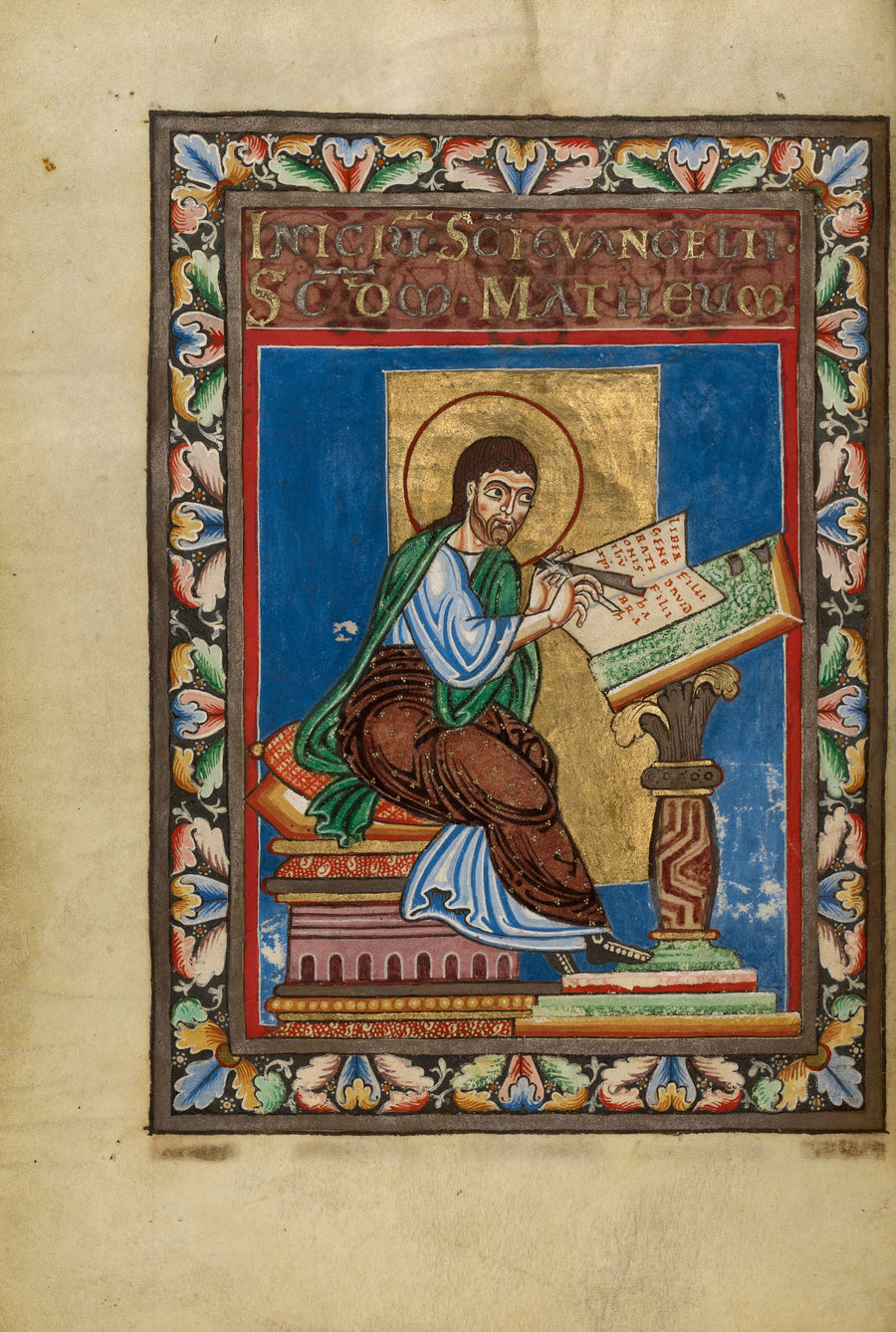 Gospel Book: Saint Matthew | Illuminated Manuscript Print shown to scale on a wall above a sofa