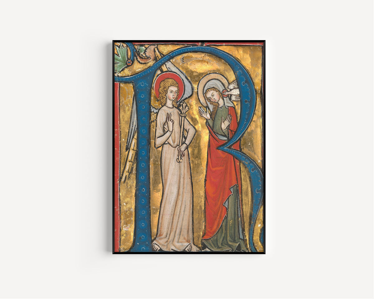 Framed art print of Gradual: The Annunciation in an Initial R, in a slim black frame on a plain white wall