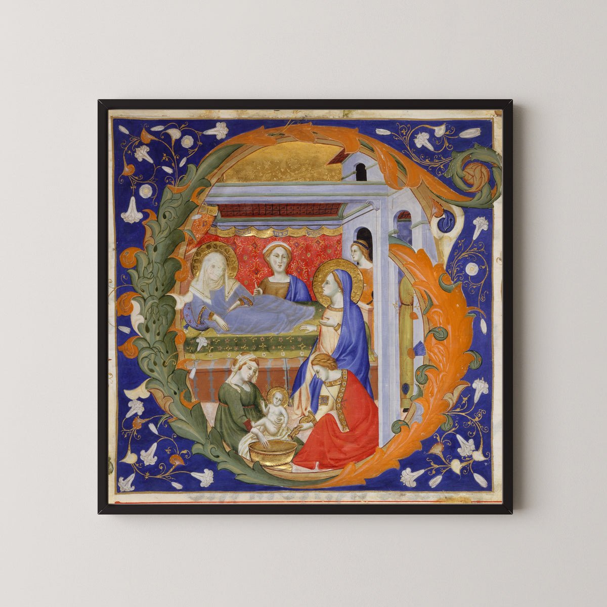 Framed art print of Gradual: The Birth of the Virgin in an Initial G by Don Silvestro de' Gherarducci, in a black frame on a pale wall