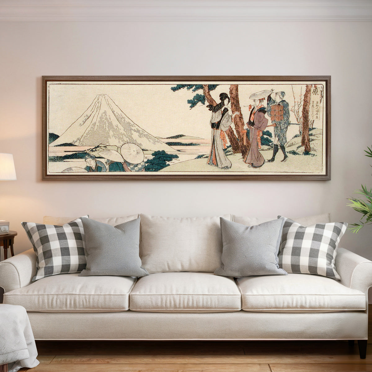 Framed art print of Hara. 3 ri and 6 chō to Yoshiwara by Katsushika Hokusai, above a cream sofa