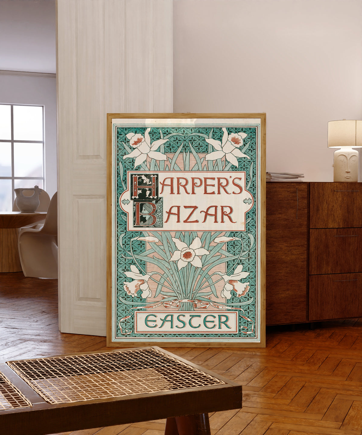 Framed art print of Harper's Bazar, Easter by Louis Rhead, in a light wood frame leaning in a warm room with a parquet floor