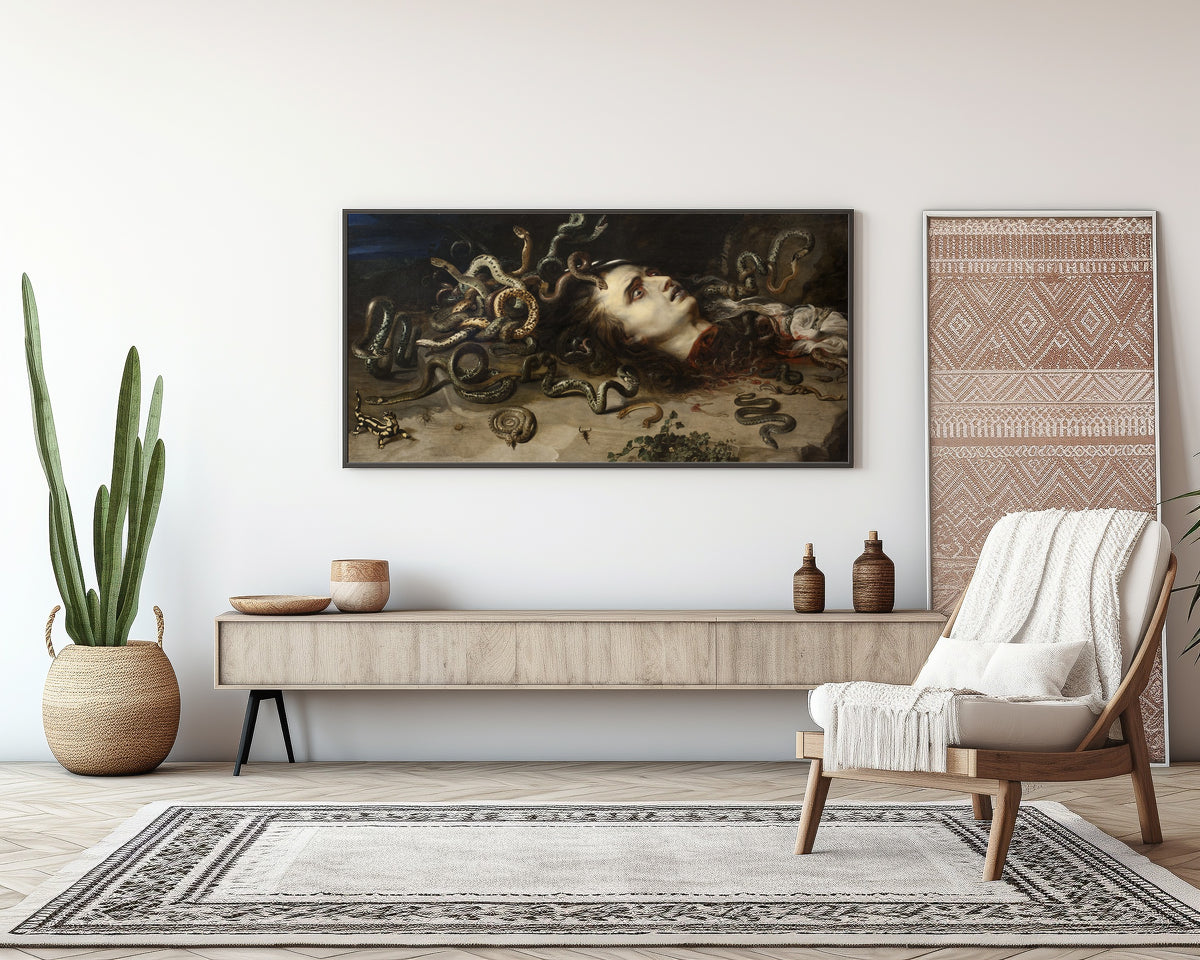 Framed art print of Head of Medusa by Peter Paul Rubens, above a sideboard in a living room