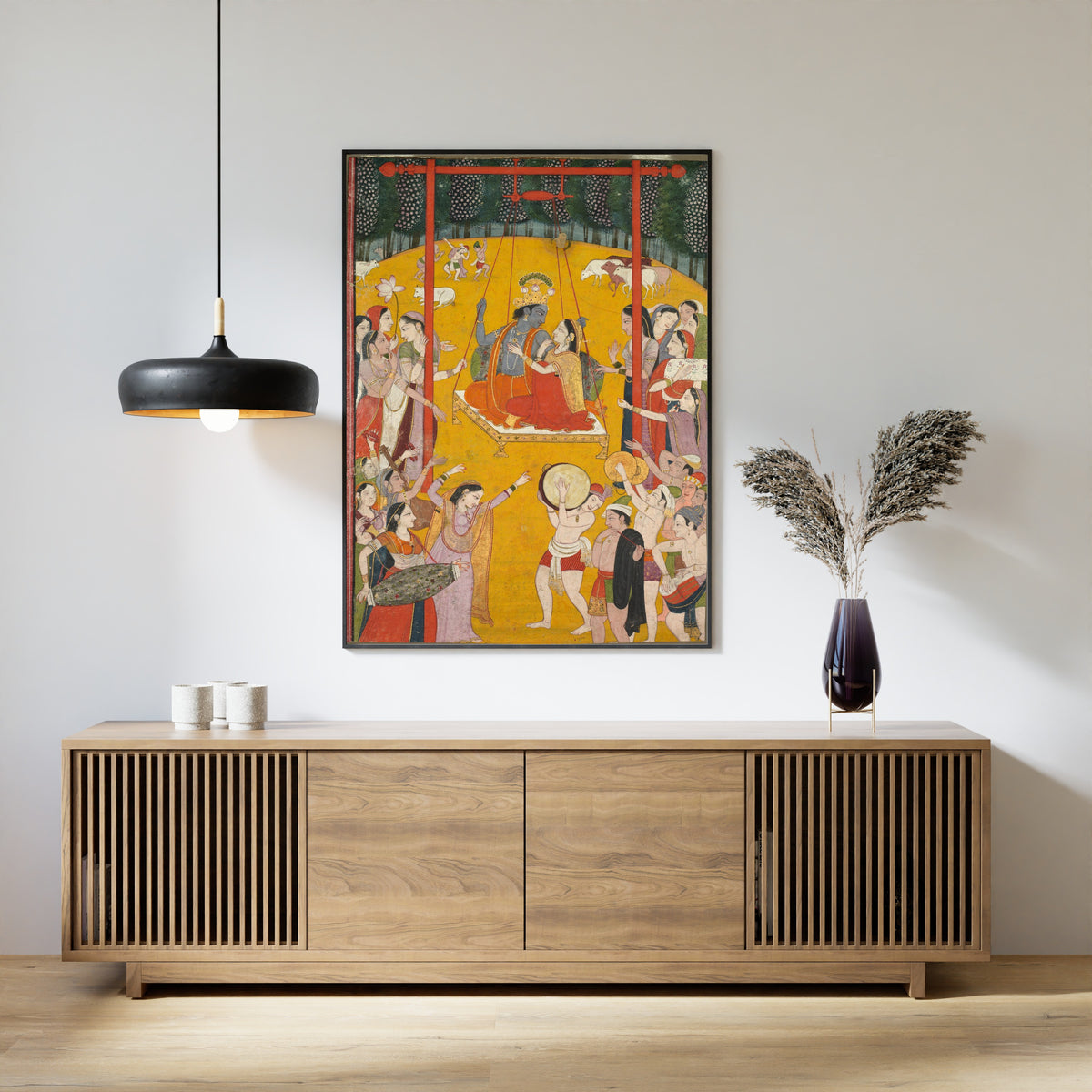 Framed art print of Hindola Raga by Pahari school, above a slatted wood sideboard