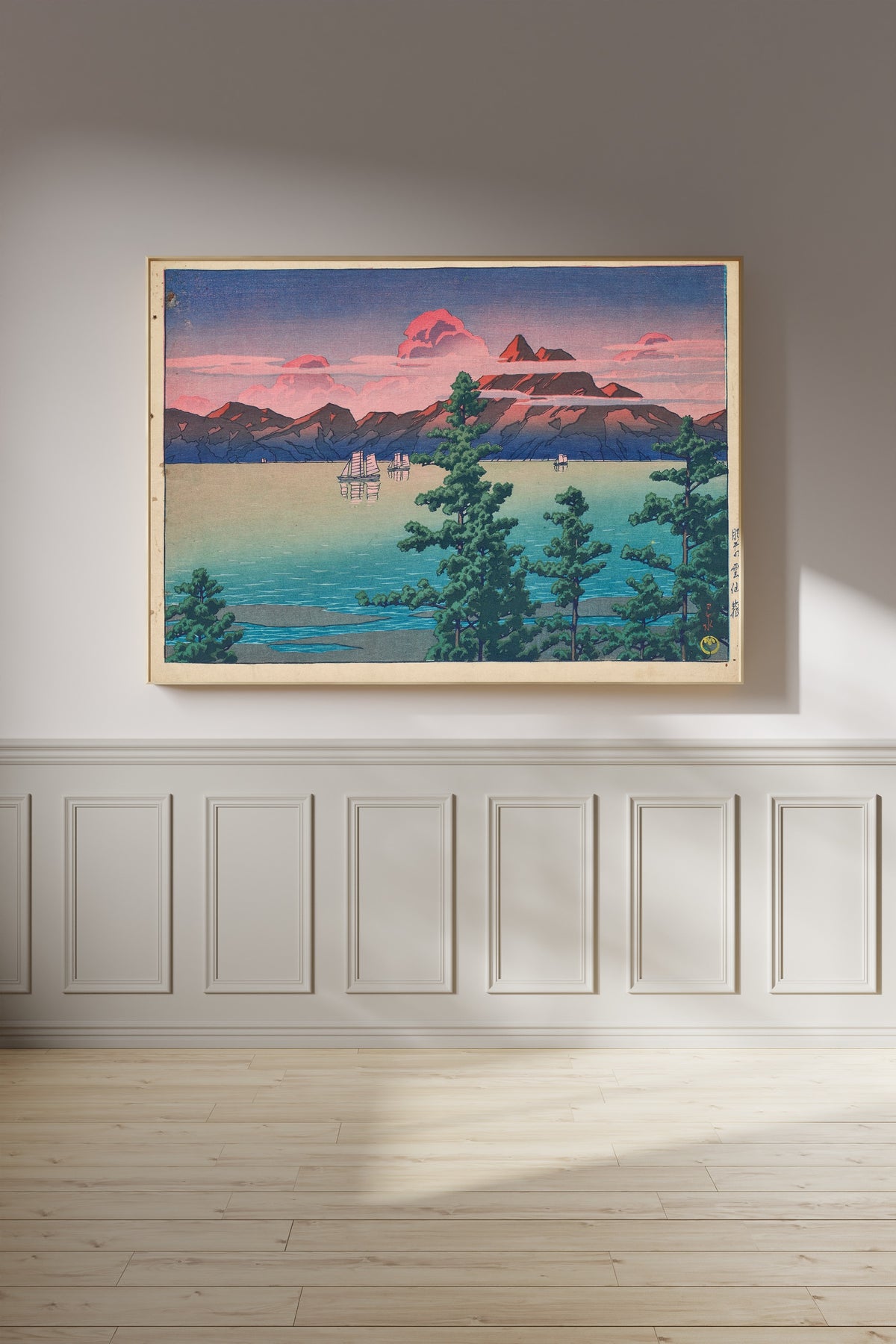 Framed art print of Hizen, Mount Unzen by Kawase Hasui, on a panelled wall in afternoon light