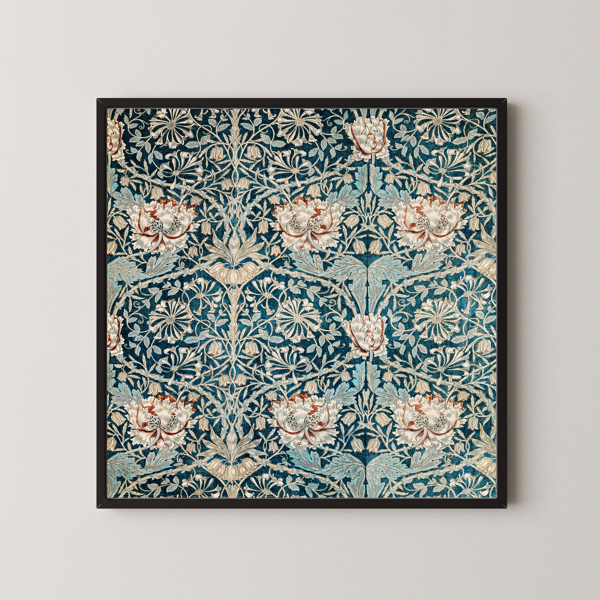 Framed art print of Honeysuckle (Blue Linen) by William Morris, in a black frame on a pale wall