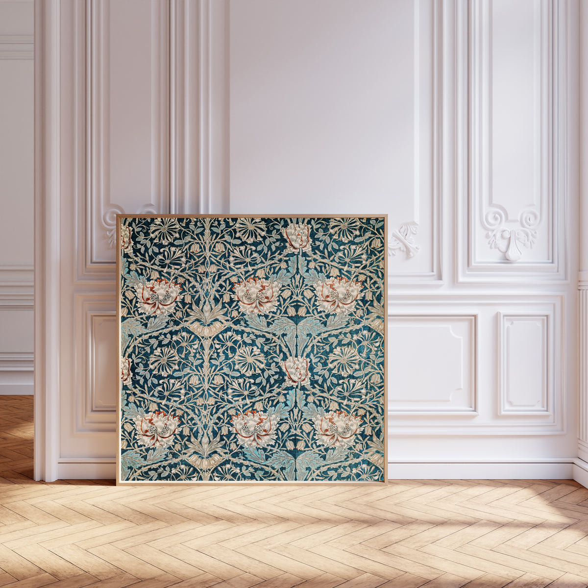 Framed art print of Honeysuckle (Blue Linen) by William Morris, leaning against pale pink panelling on a herringbone floor