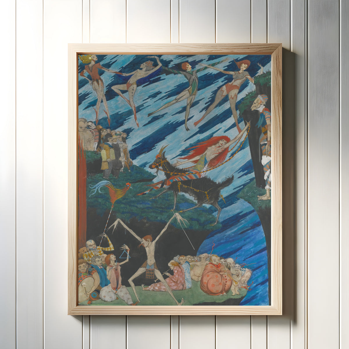 Framed art print of I’ll Fly From This Place, With One Bound, To Hell, Or Anywhere, To Leave ’em by Harry Clarke, in a light wood frame on a white panelled wall