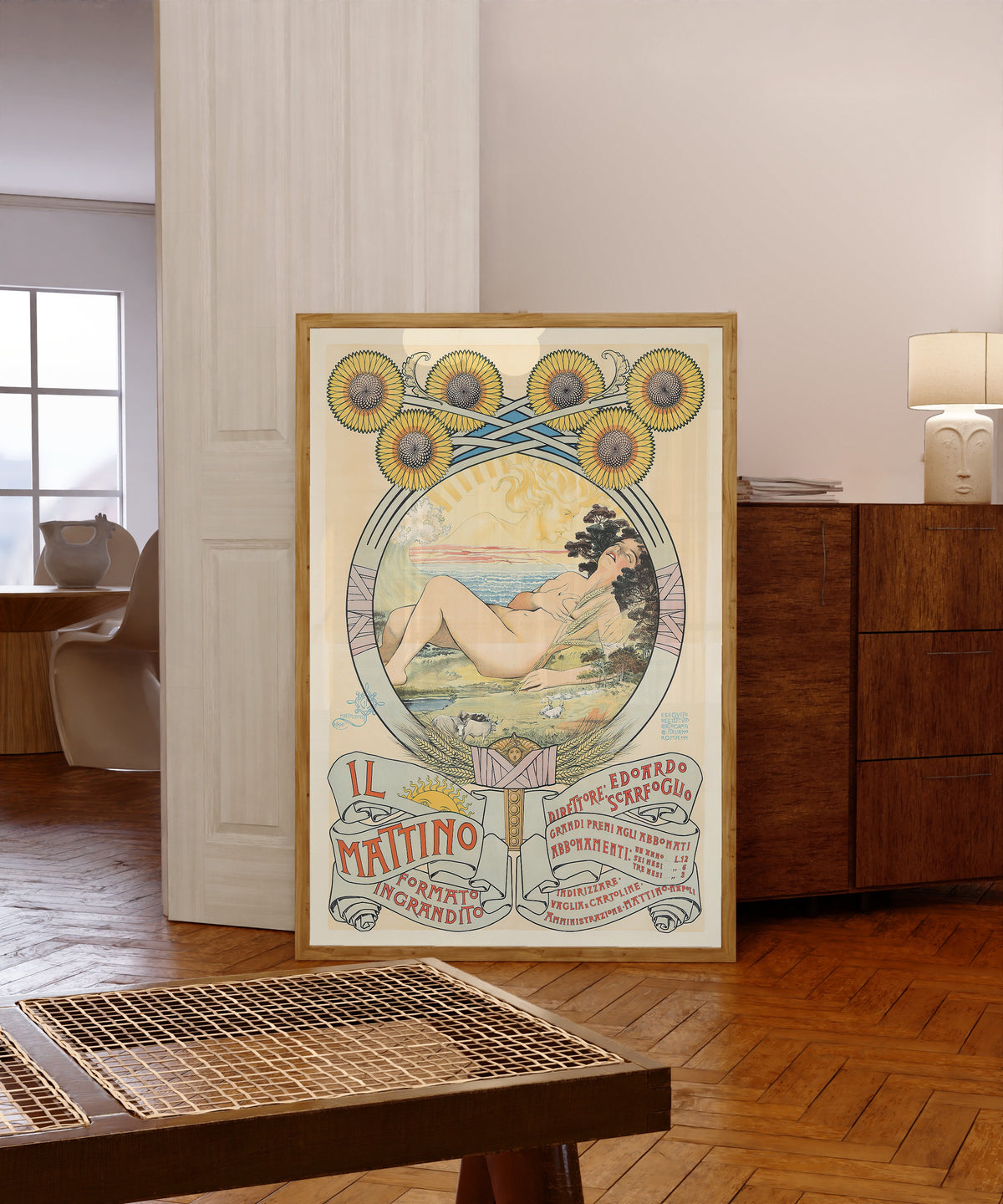 Framed art print of Il Mattino by Giovanni Maria Mataloni, in a light wood frame leaning in a warm room with a parquet floor