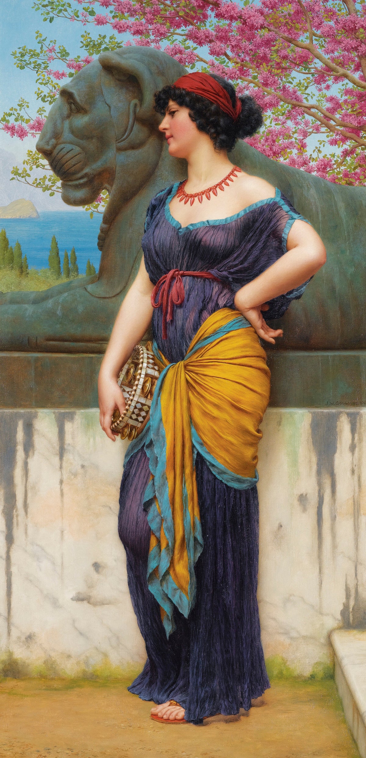 In the Grove of the Temple of Isis by John William Godward — A woman with a tambourine stands by a stone lion under pink blossom