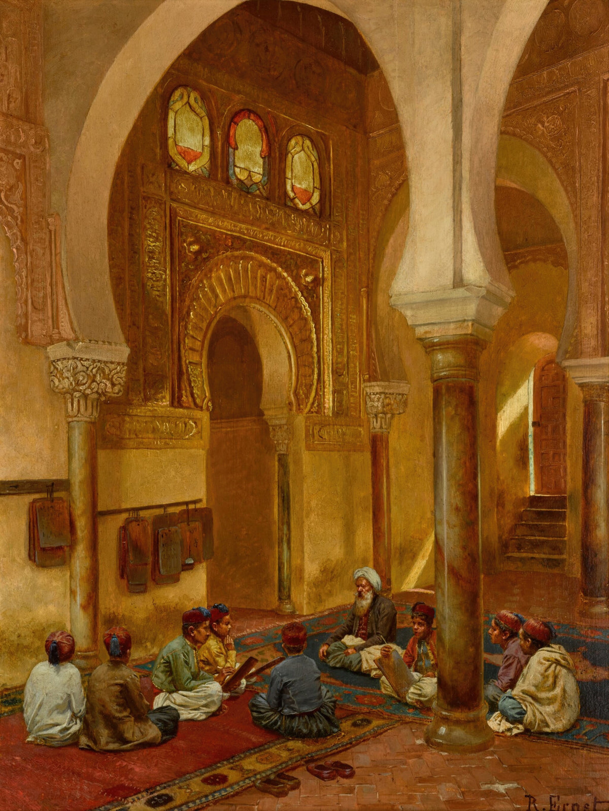 In the Madrasa by Rudolf Ernst — Boys sit with their teacher on carpets beneath a gilded arch