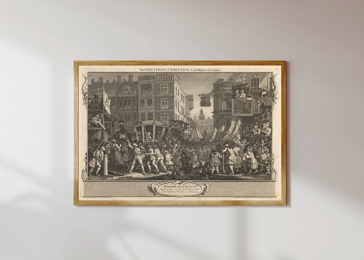 Framed art print of Industry and Idleness, Plate 12: The Industrious 'Prentice Lord Mayor of… by William Hogarth, in a light wood frame on a sunlit white wall
