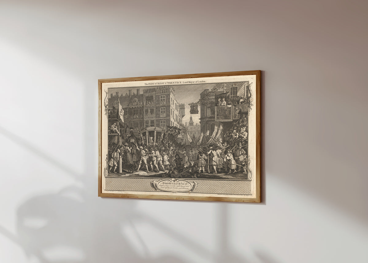 Framed art print of Industry and Idleness, Plate 12: The Industrious… by William Hogarth, in a light wood frame on a sunlit white wall, seen at a slight angle