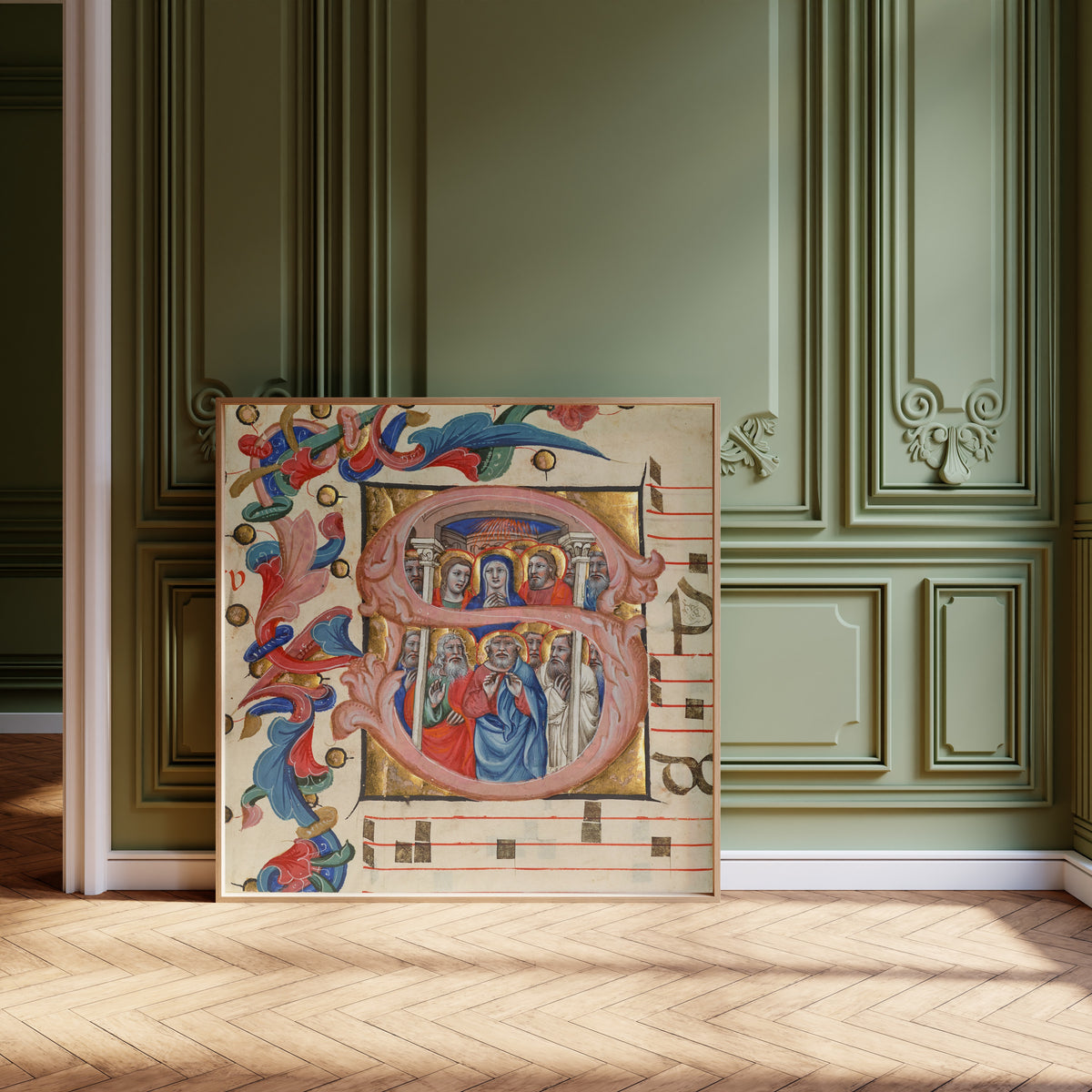 Framed art print of Initial S: Pentecost by Niccolò di Giacomo da Bologna, leaning against olive-green panelling on a herringbone floor