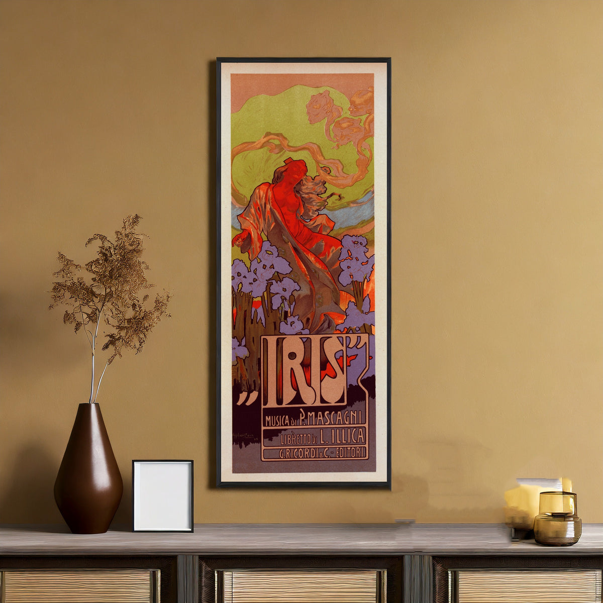 Framed art print of Iris by Adolfo Hohenstein, on an ochre wall above a console table
