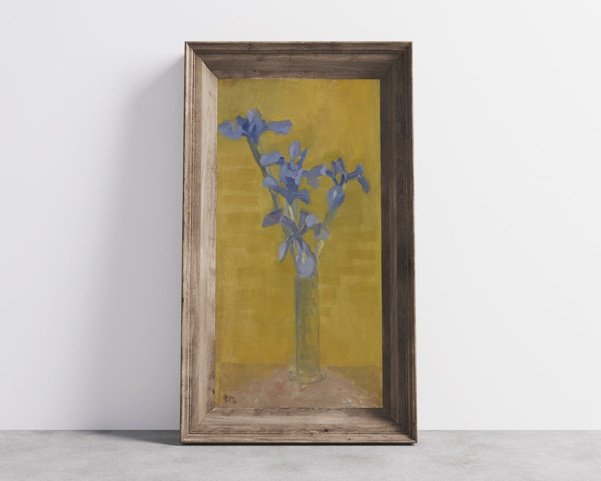 Framed art print of Irises by Piet Mondrian, in a wide wooden frame leaning against a concrete wall