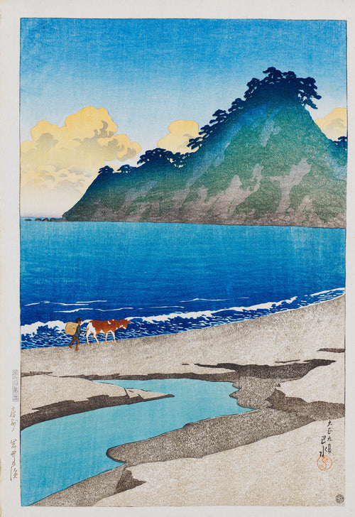 Iwai Beach, Awa Province by Kawase Hasui — A green headland above deep blue surf, a figure and a cow on the sand