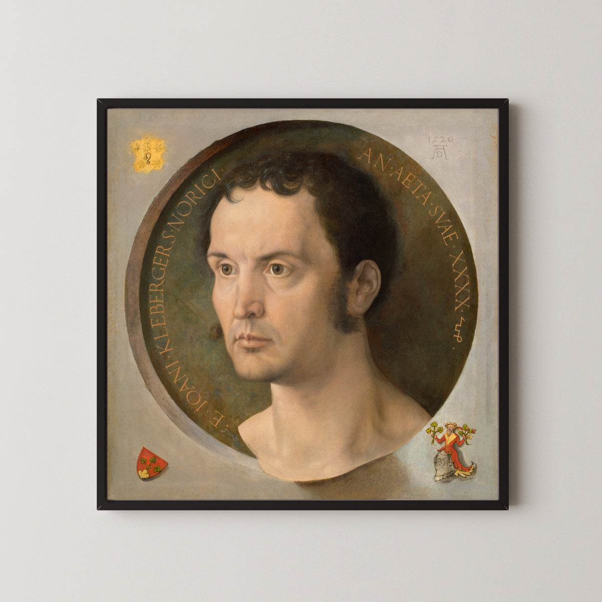Framed art print of Johannes Kleberger by Albrecht Dürer, in a black frame on a pale wall