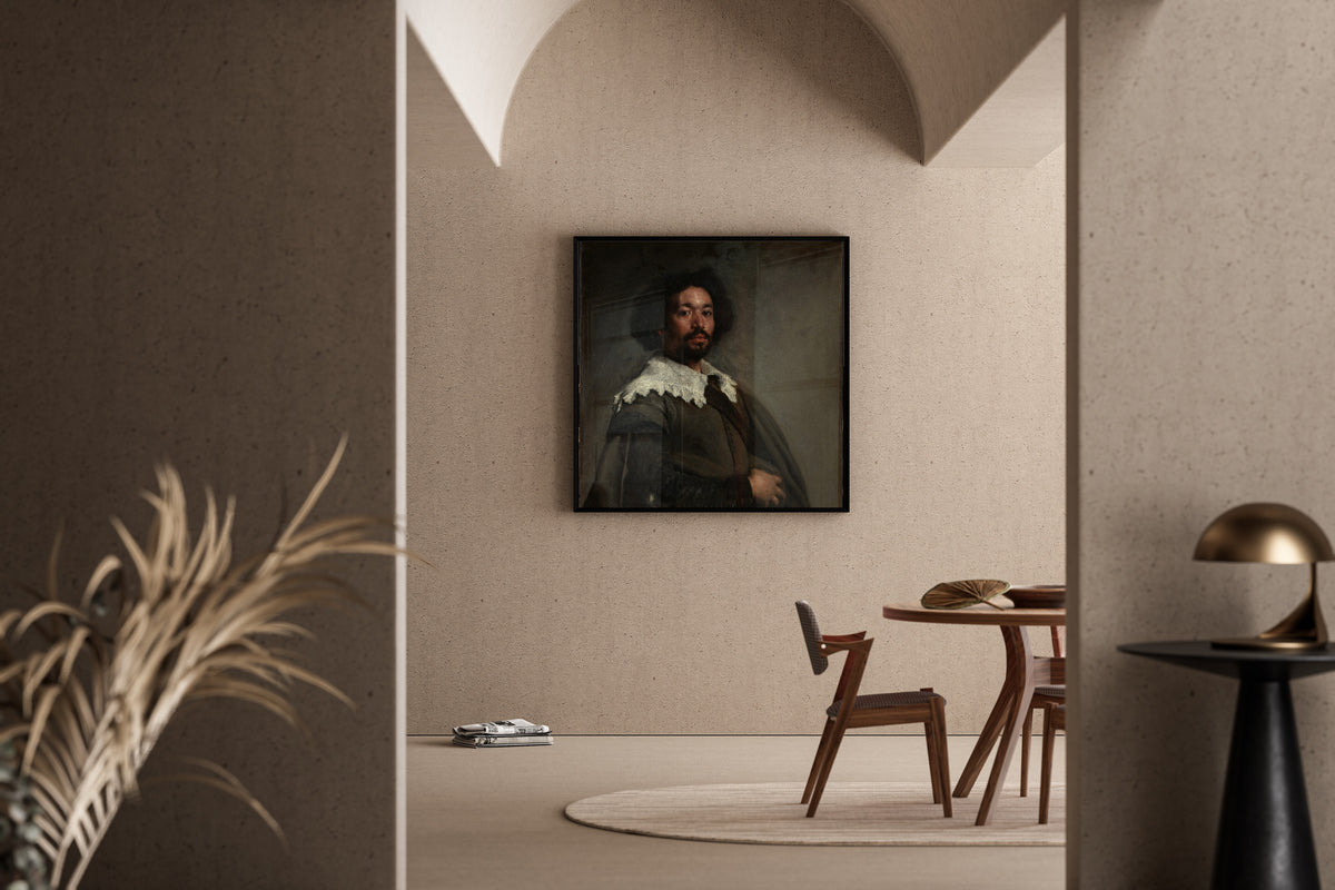 Framed art print of Juan de Pareja by Diego Velázquez, in a sunlit dining corner