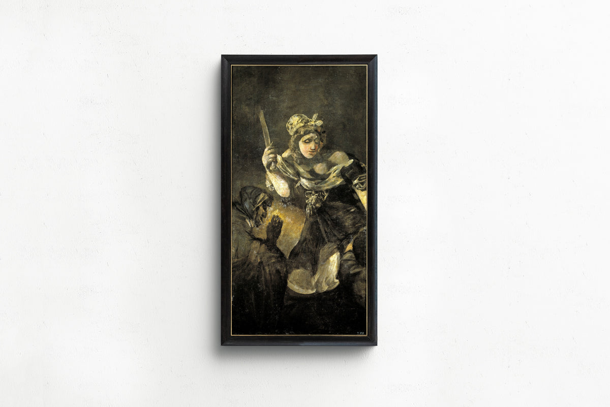 Framed art print of Judith and Holofernes by Francisco de Goya, in a slim black frame on a plain white wall