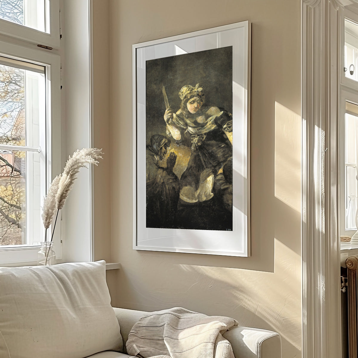 Framed art print of Judith and Holofernes by Francisco de Goya, in a sunlit living room above a sofa