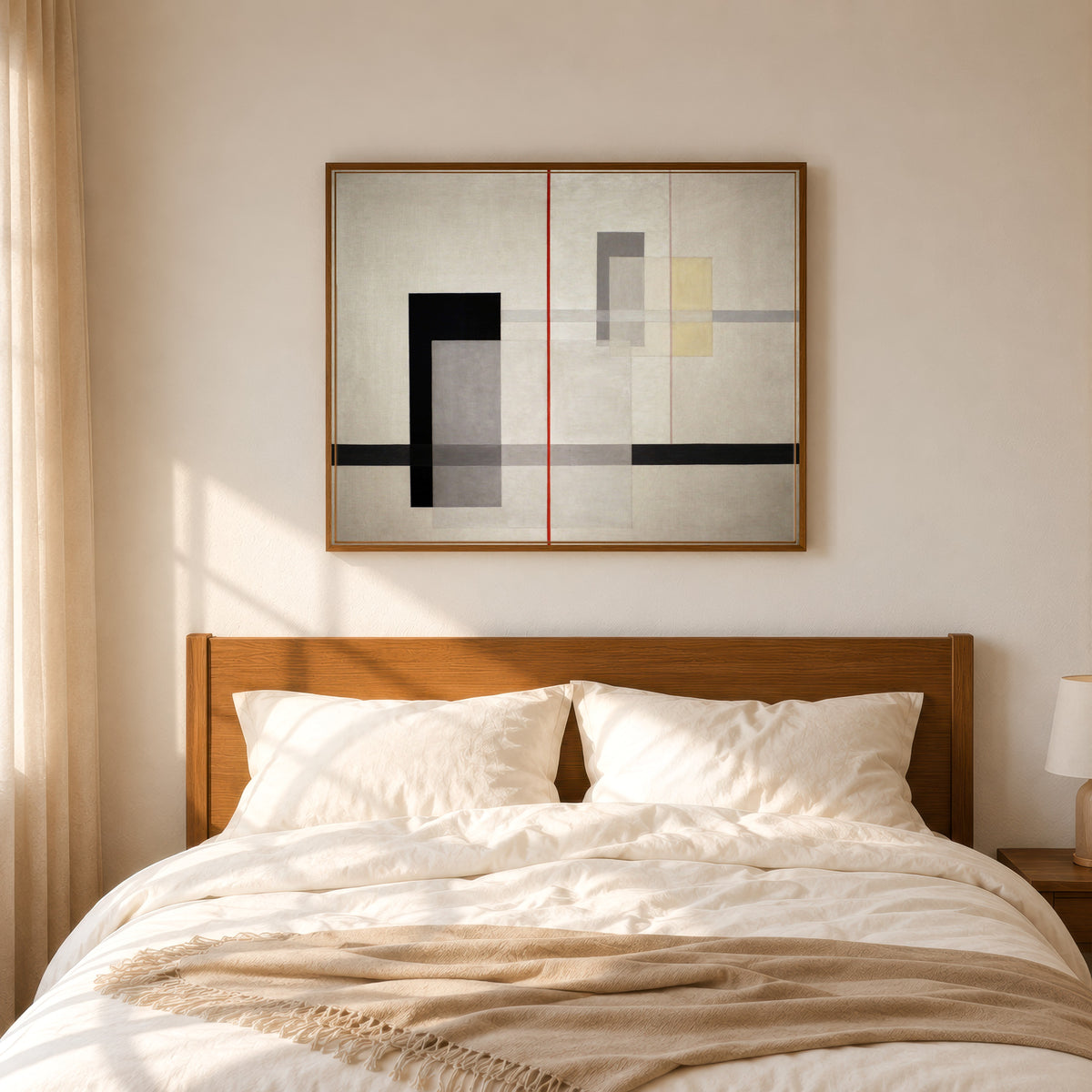 Framed art print of K VII by László Moholy-Nagy, in a slim wood frame above a bed in a sunlit bedroom