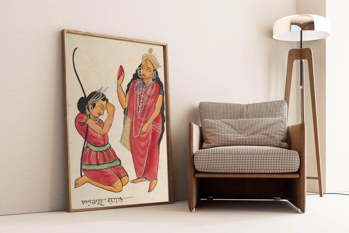 Framed art print of Kalaketu Receiving a Boon from the Goddess Chandi by Kalighat painter, leaning against a wall beside an armchair and a floor lamp