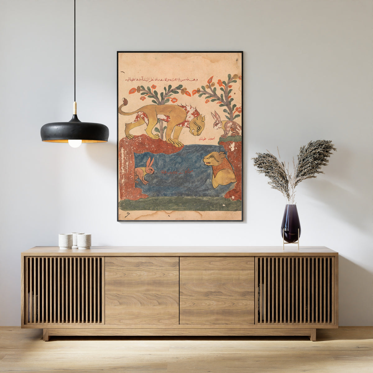 Framed art print of Kalila wa Dimna: The Hare, the Lion, and the Well, above a slatted wood sideboard