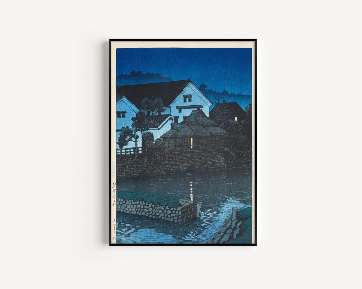 Framed art print of Kasuga-cho, Kumamoto by Kawase Hasui, in a slim black frame on a plain white wall