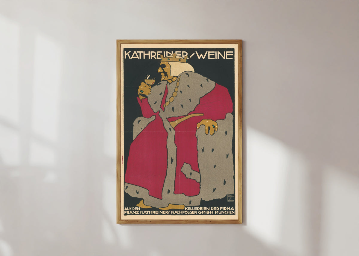 Framed art print of Kathreiner Weine by Ludwig Hohlwein, in a light wood frame on a sunlit white wall