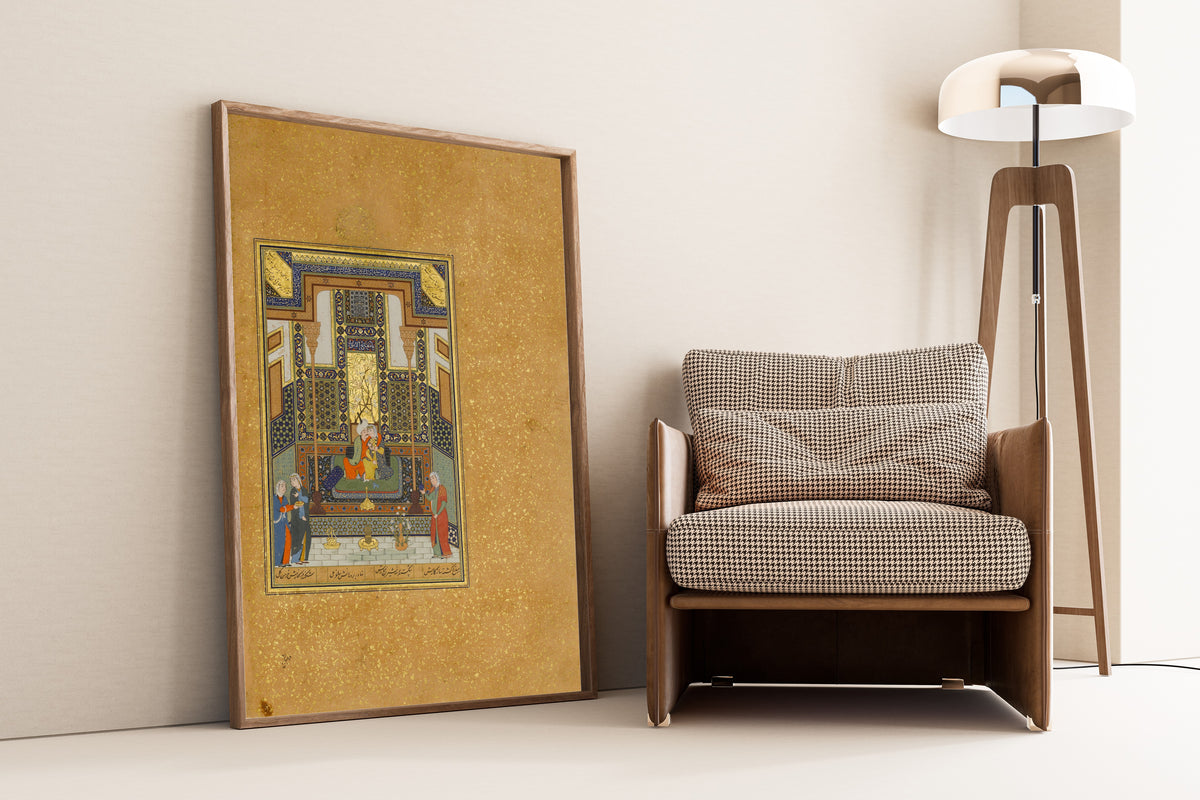 Framed art print of Khamsa of Nizami: Marriage of Khusrau and Shirin by Shaikh Zada, leaning against a wall beside an armchair and a floor lamp