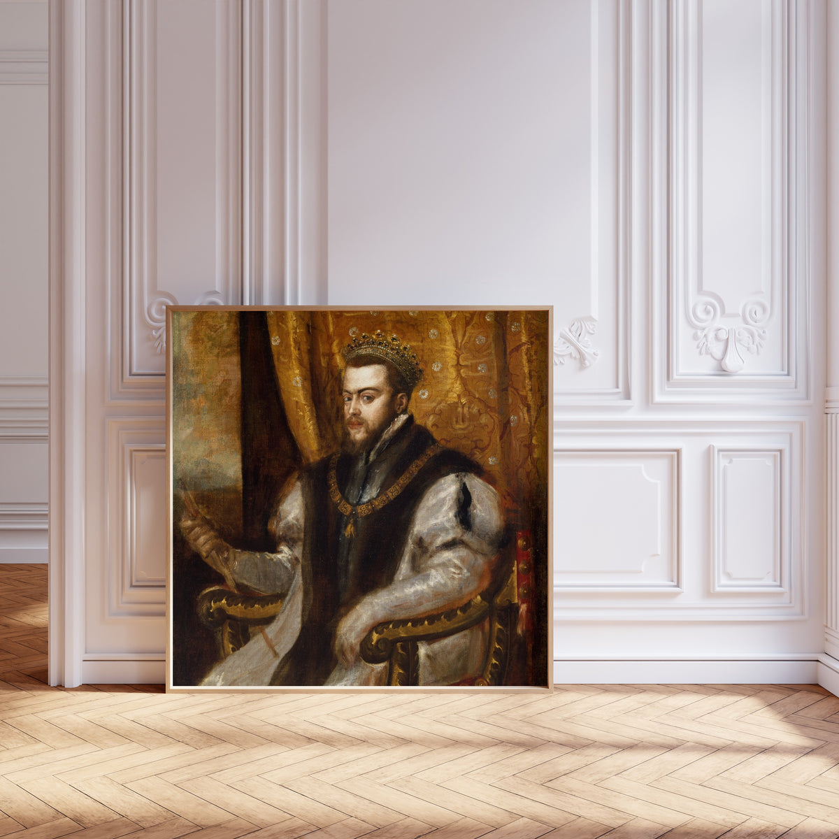 Framed art print of King Philip II of Spain by Titian, leaning against pale pink panelling on a herringbone floor