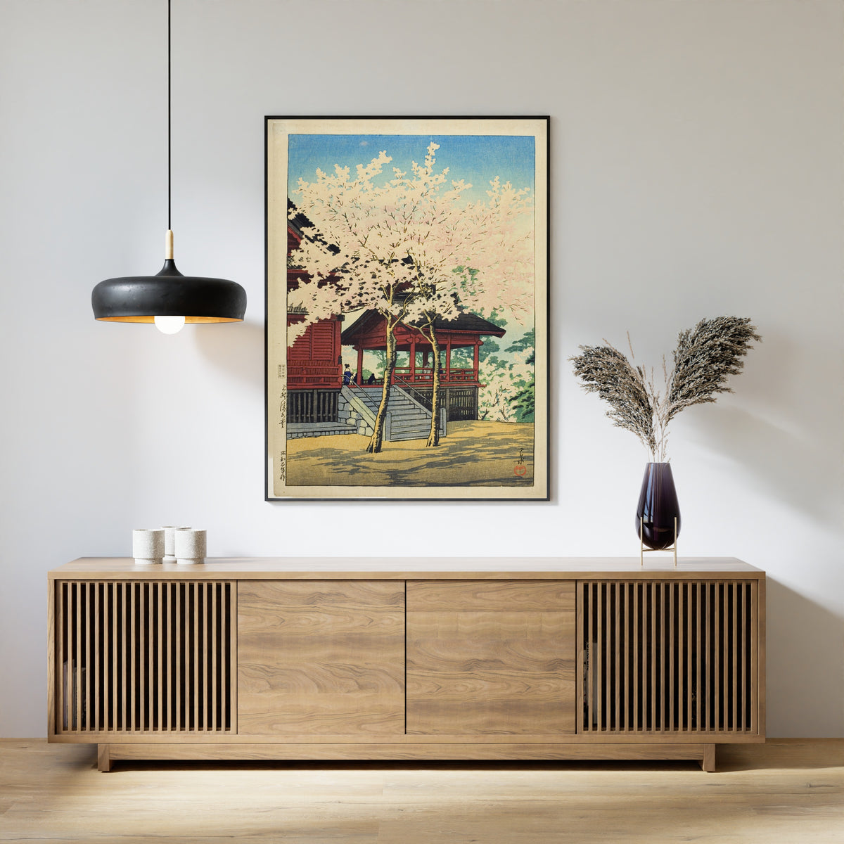 Framed art print of Kiyomizu Hall, Ueno by Kawase Hasui, above a slatted wood sideboard