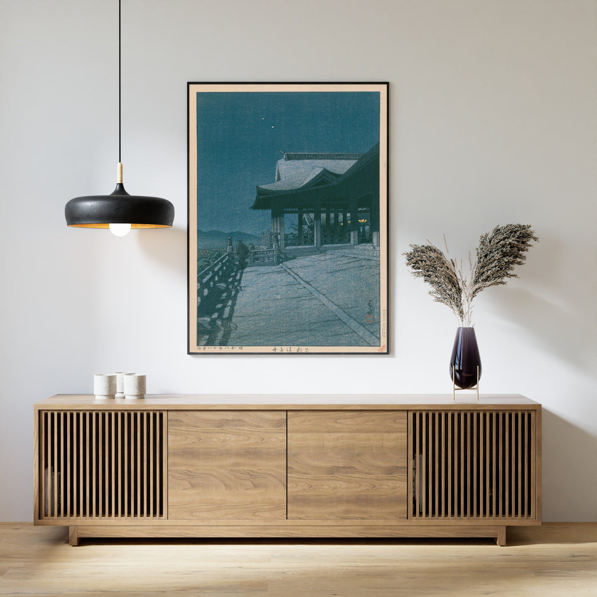 Framed art print of Kiyomizu Temple, Kyoto by Kawase Hasui, above a slatted wood sideboard