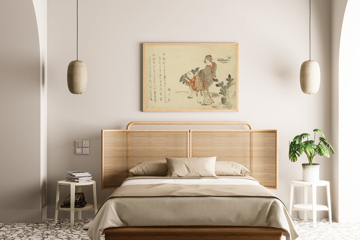 Framed art print of Komatsubiki by Katsushika Hokusai, above a cane-headboard bed