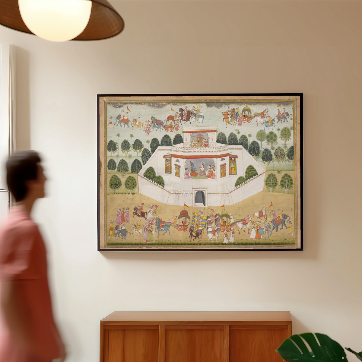 Framed art print of Krishna and Balarama within a Walled Palace by Bikaner school, in a slim black frame on a warm wall in a sunlit room