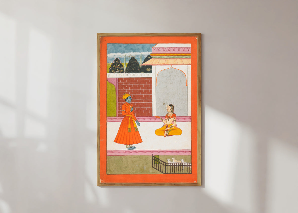 Framed art print of Krishna and Radha by Bikaner school, in a light wood frame on a sunlit white wall