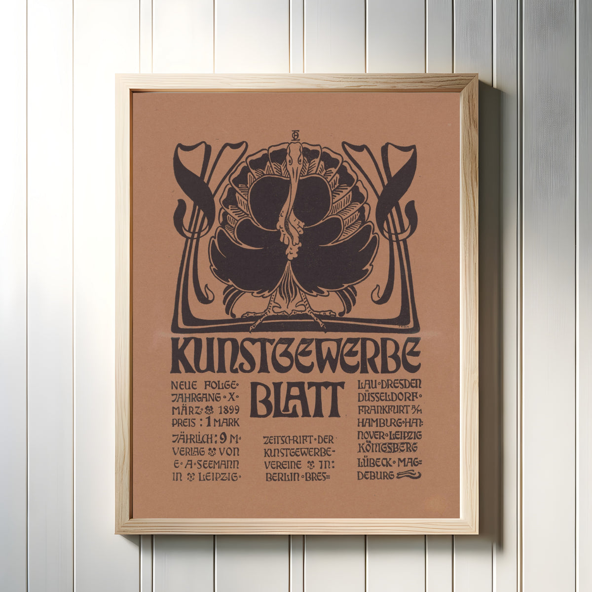 Framed art print of Kunstgewerbeblatt, Neue Folge, März 1899 by Otto Eckmann, in a light wood frame on a white panelled wall