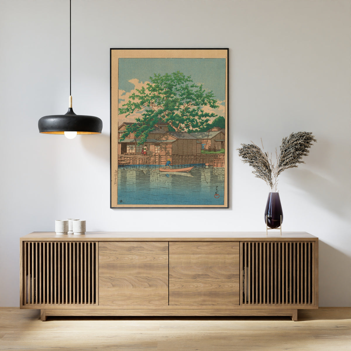 Framed art print of Kuri Ferry, Funabori by Kawase Hasui, above a slatted wood sideboard
