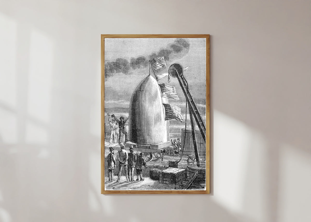 Framed art print of L'arrivée du projectile à Stone's-Hill (The projectile's arrival at… by Henri de Montaut, in a light wood frame on a sunlit white wall