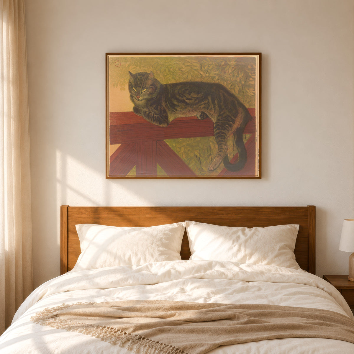 Framed art print of L’Été, chat sur une balustrade by Théophile Steinlen, in a slim wood frame above a bed in a sunlit bedroom