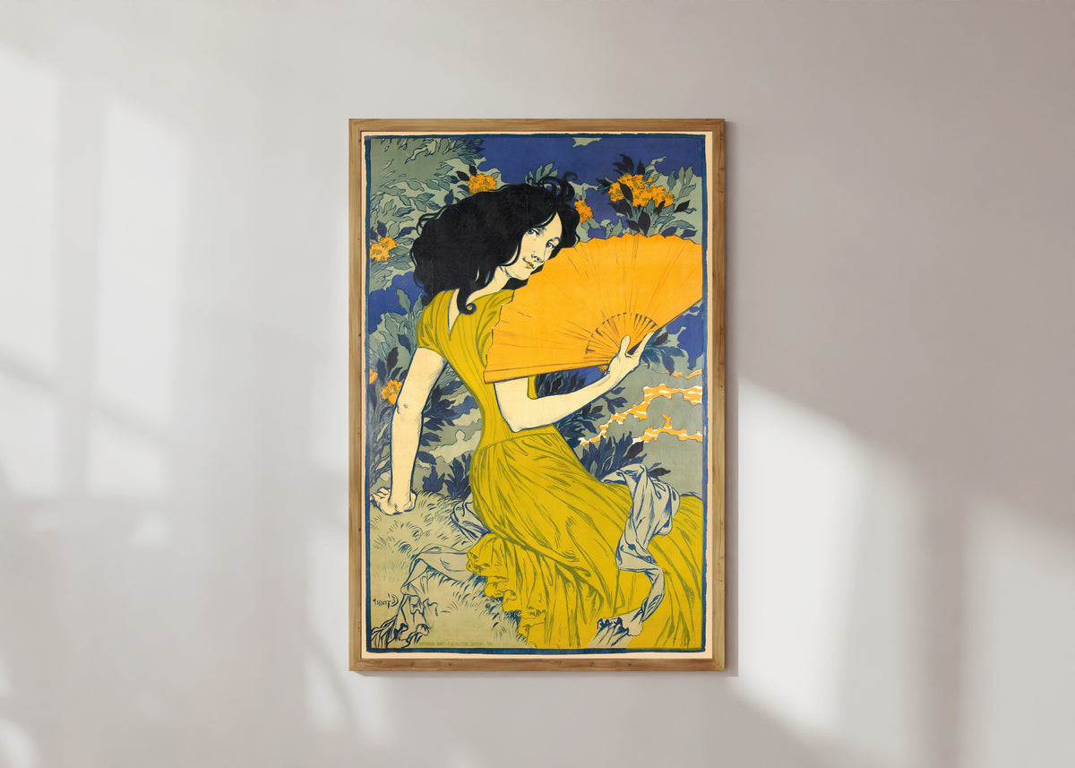 Framed art print of L'Éventail by Eugène Grasset, in a light wood frame on a sunlit white wall