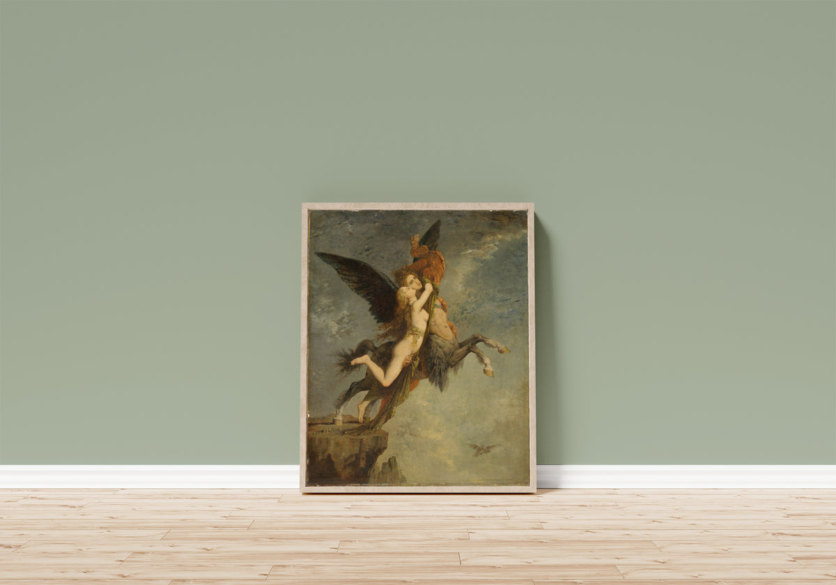 Framed art print of La Chimère by Gustave Moreau, in a light wood frame leaning on a sage green wall above a wooden floor