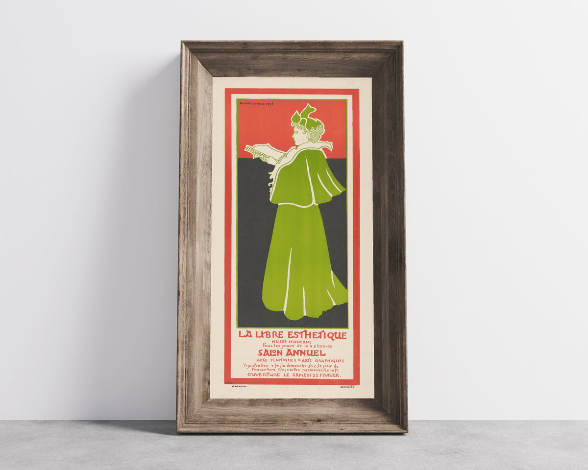 Framed art print of La Libre Esthétique, Salon Annuel (1896) by Gisbert Combaz, in a wide wooden frame leaning against a concrete wall