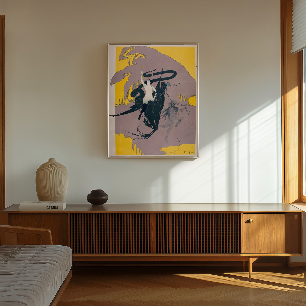 Framed art print of La Reine de la nuit by Georges de Feure, in a thin light frame on a sunlit wall above a wooden sideboard