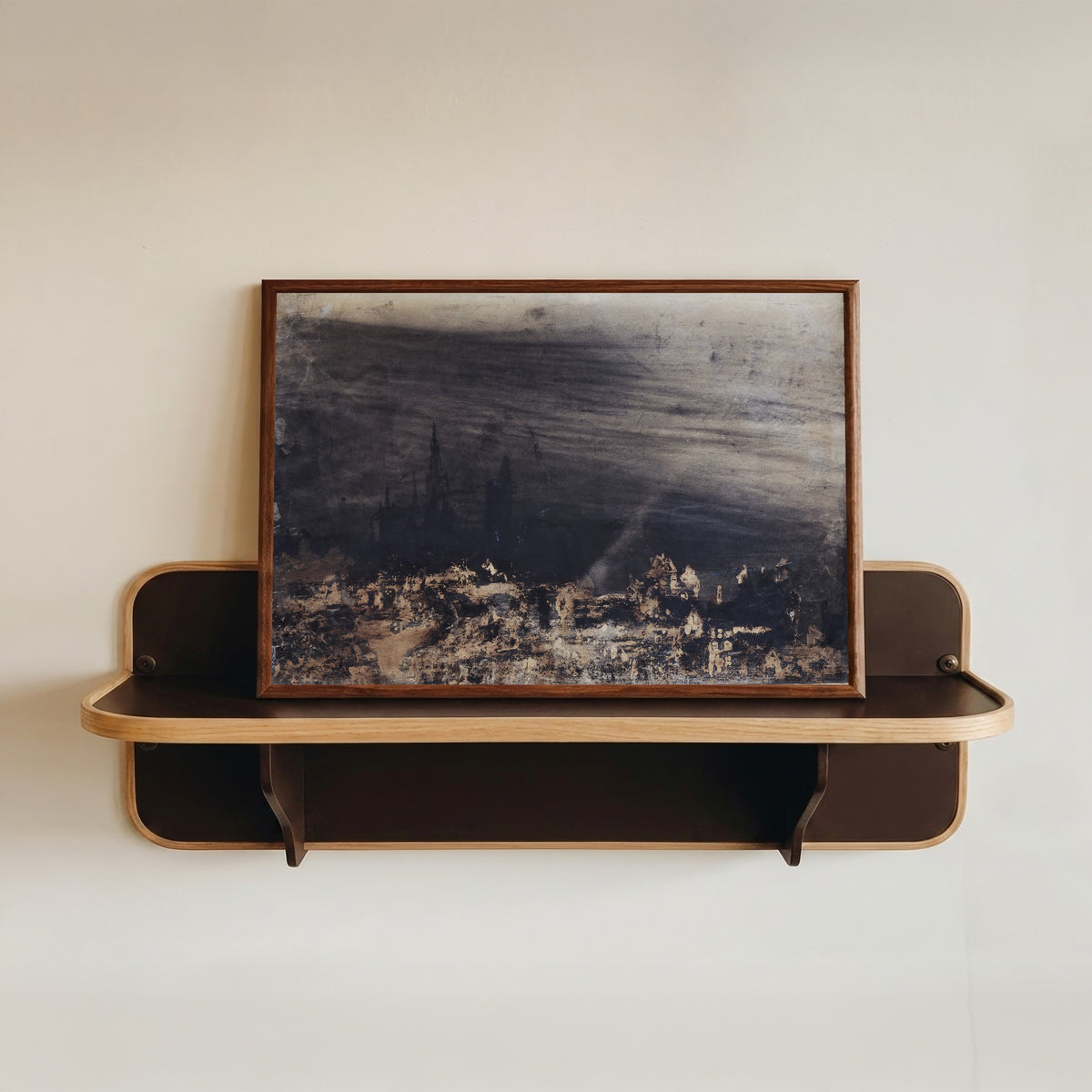 Framed art print of La Ville morte (The Dead City) by Victor Hugo, in a dark wood frame resting on a wall shelf