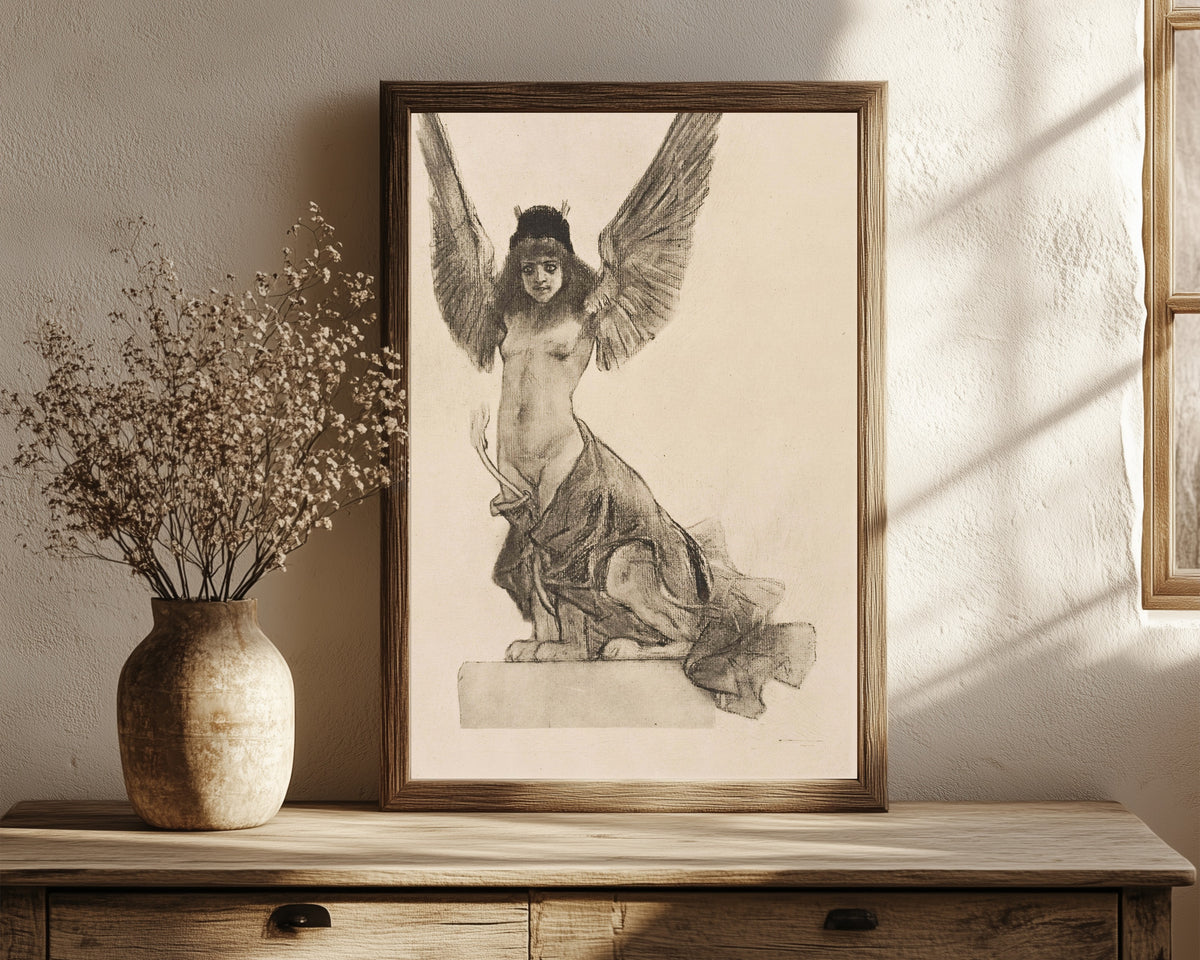 Framed art print of La sphynge ou Parallèlement by Félicien Rops, in a dark wood frame leaning on a rustic console beside dried flowers