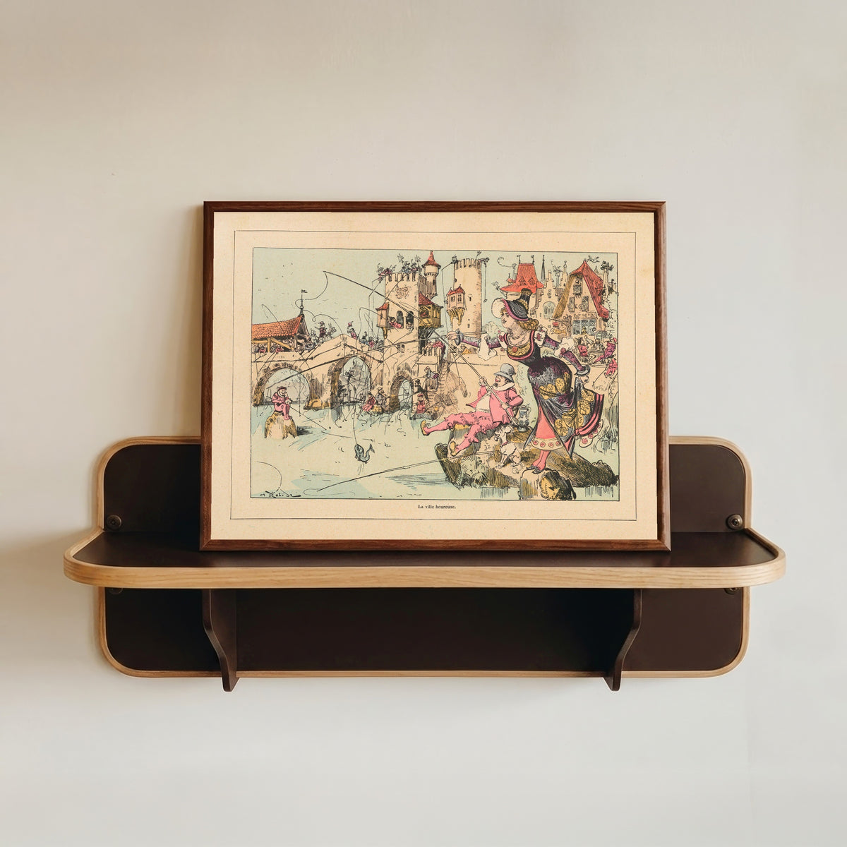 Framed art print of La ville heureuse by Albert Robida, in a dark wood frame resting on a wall shelf