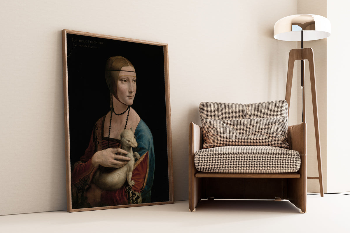 Framed art print of Lady with an Ermine – Portrait of Cecilia Gallerani by Leonardo da Vinci, leaning against a wall beside an armchair and a floor lamp