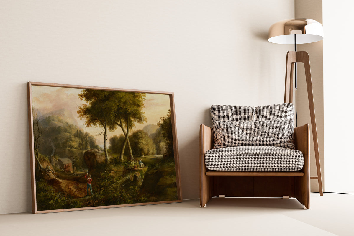 Landscape by Thomas Cole — framed and leaning against a wall beside an armchair and a floor lamp