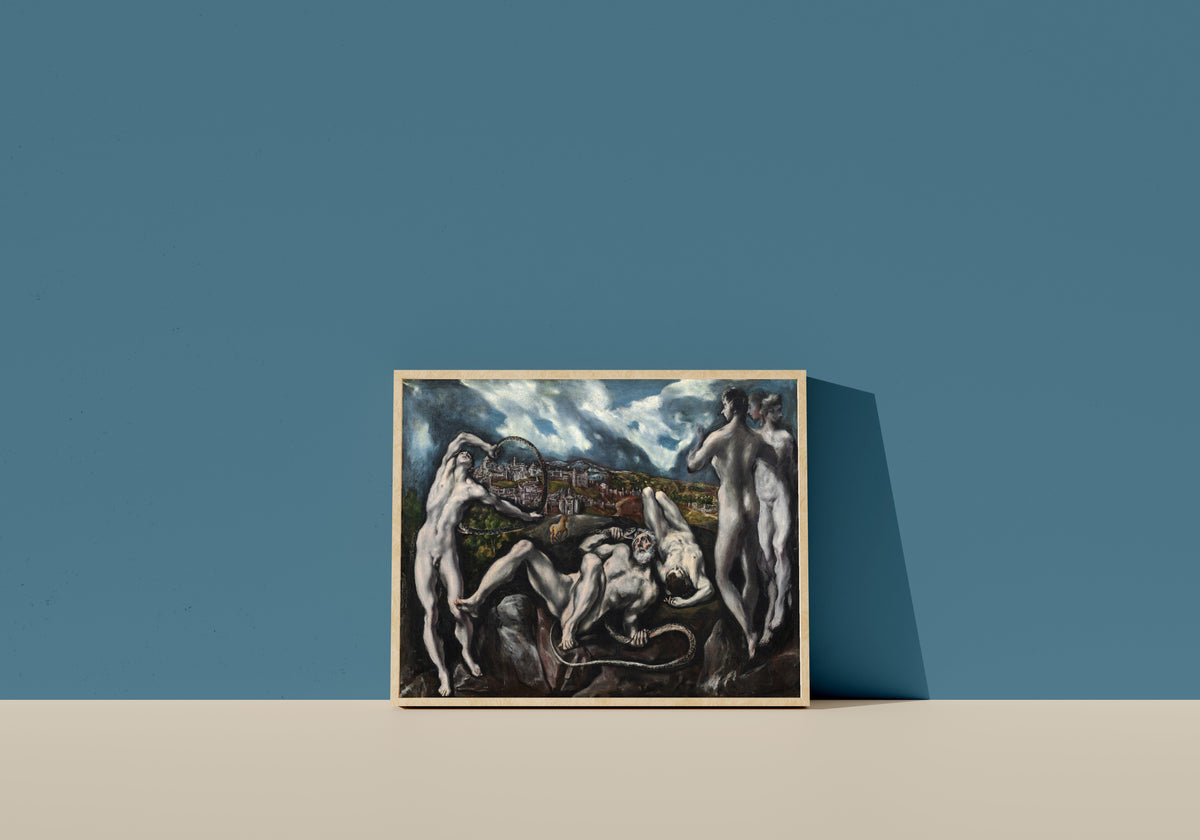 Framed art print of Laocoön by El Greco, in a light wood frame leaning on a blue wall